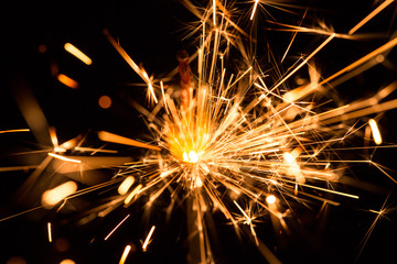 Christmas and New Year party sparkler on black