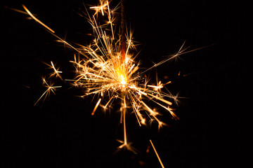 Christmas and New Year party sparkler on black