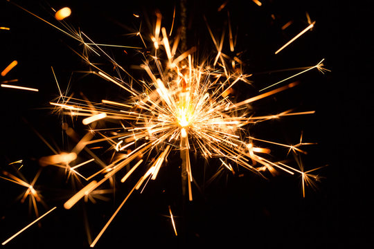 Christmas and New Year party sparkler on black