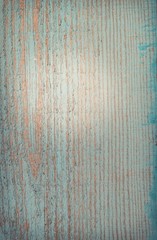 Old wooden surface with peeling blue paint
