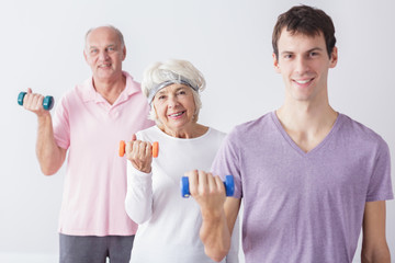 Elderly couple with personal trainer