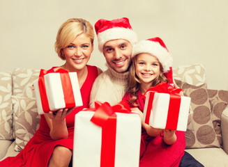 smiling family giving many gift boxes