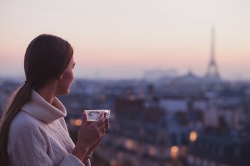 Paris, woman enjoying panoramic view of Eiffel Tower