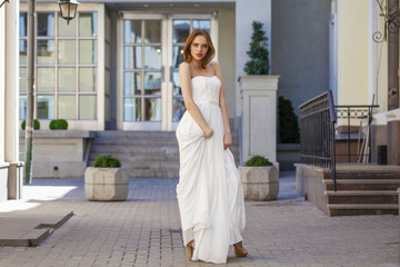 Fototapeta premium Full length portrait of beautiful model woman with long legs wea