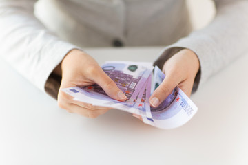 close up of woman hands counting euro money