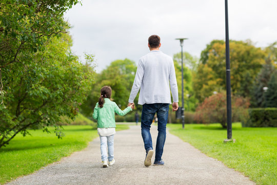 happy family walking in summer park