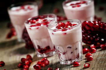 Homemade yogurt with pomegranate pink, selective focus