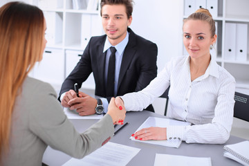 Business people shaking hands, finishing up a meeting