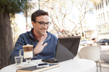 Man using the laptop in the street