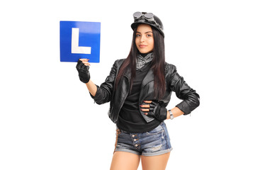 Attractive female biker holding an L-sign
