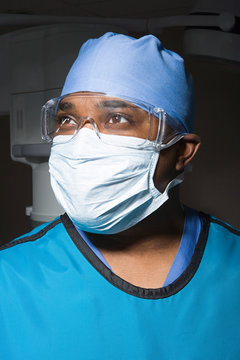 Surgeon In Mask And Safety Goggles
