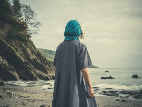 Woman wih headscarf on beach