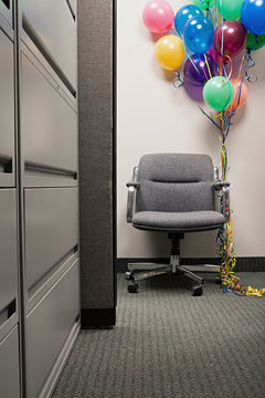 Bunch Of Balloons Tied To Office Chair