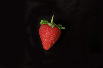 Isolated raspberry on black background