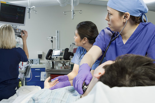 Surgeons checking patient