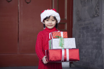 Girl Holding Christmas Gifts