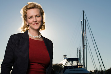 Fototapeta premium Mature woman by yacht
