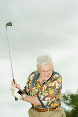 Senior man playing golf