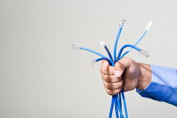 Man holding network cables