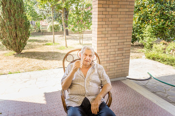 senior on chair in garden