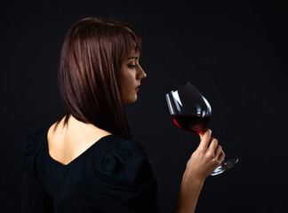 young beautiful woman with red wine