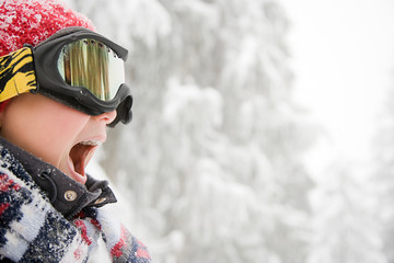Boy wearing ski goggles
