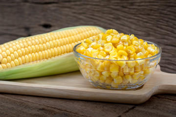 Sweet corn on wooden background