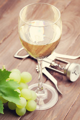 White wine glass and grapes