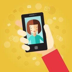 Smart phone in hand. On the yellow background with envelopes and dots. Video call with girl (brunette bob hair).