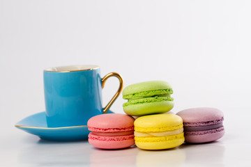 the colourful collection of French macarons, blue mug
