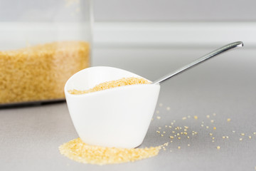 white ceramic bowl full of cane sugar
