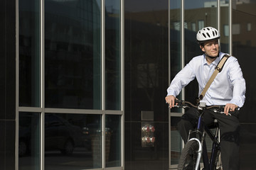 Office worker riding bicycle