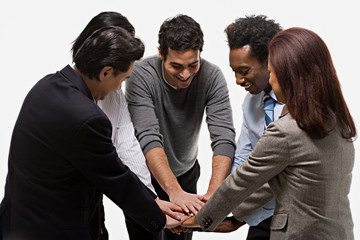 five office workers showing unity