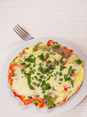 omelet with bacon, vegetables and cheese