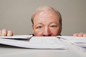 Man behind cabinet