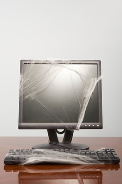 Computer Covered In Cobweb