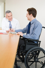 Naklejka na ściany i meble Disabled male office worker