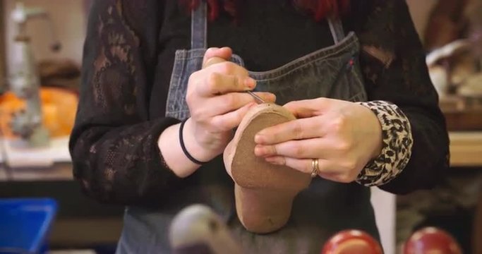 Bespoke Shoemaker Pinning Leather Together To Make Shoe