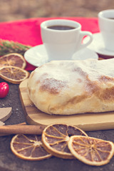 .Strudel with custard and orange. Christmas Stollen. Christmas table decoration.