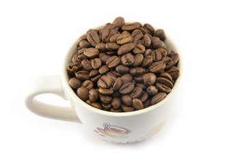 Cup full of coffee beans isolated