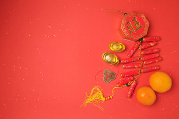 Obraz na płótnie Canvas Chinese New Year decorations on red background. View from above with copy space