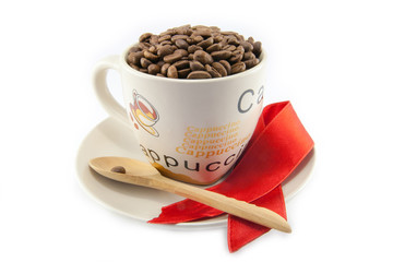 Cup full of coffee beans isolated