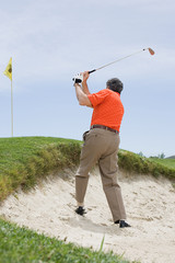 Man playing golf