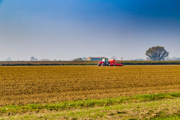 tractor plowing a field