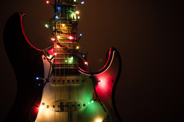 electric guitar wrapped by garland