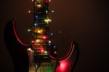 electric guitar wrapped by garland