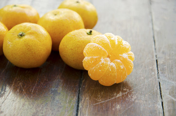 Orange has a wooden floor in the background.