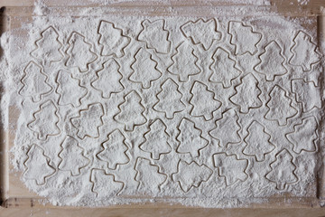 form for christmas cookies on flour