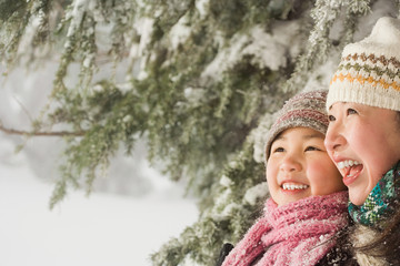 Mother and daughter in snow