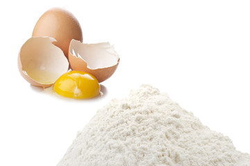 a pound of flour and egg close up on the white